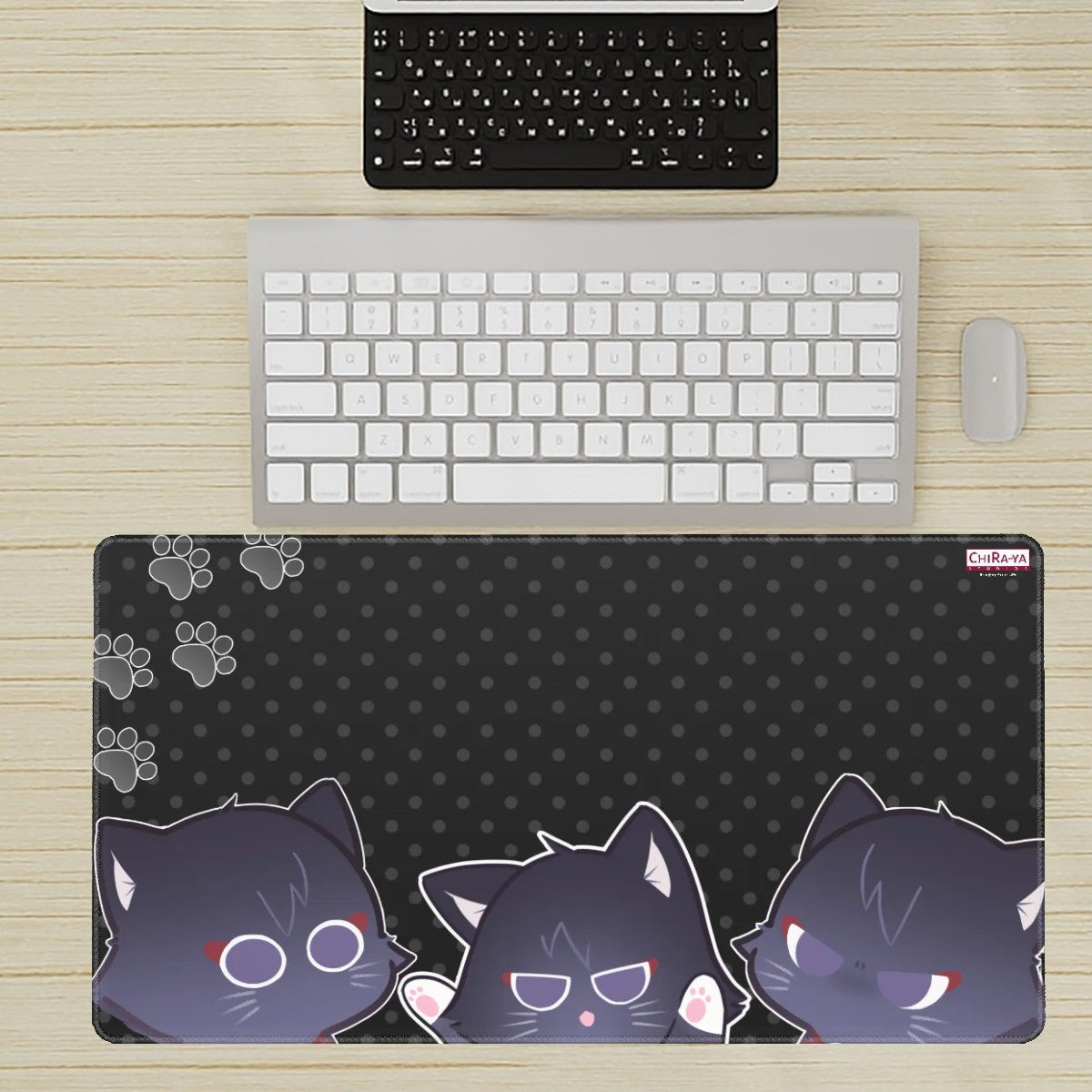 desk setup with extra large anime mouse pad featuring various Scarameow emotions