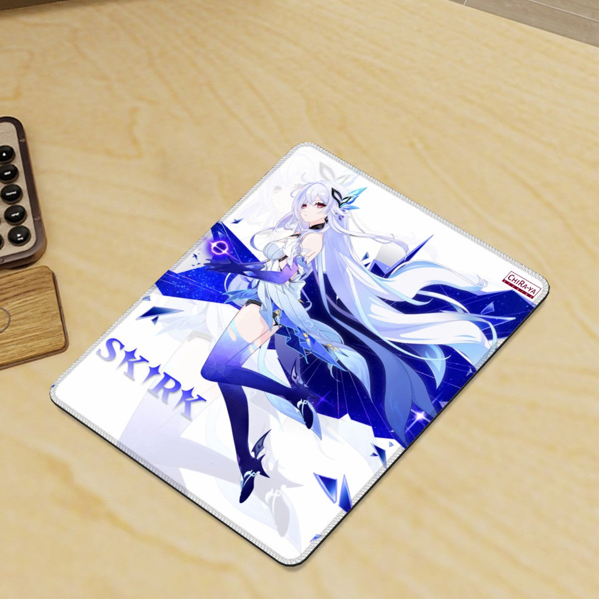 gaming desk with vertical anime mouse pad featuring Skirk in white background