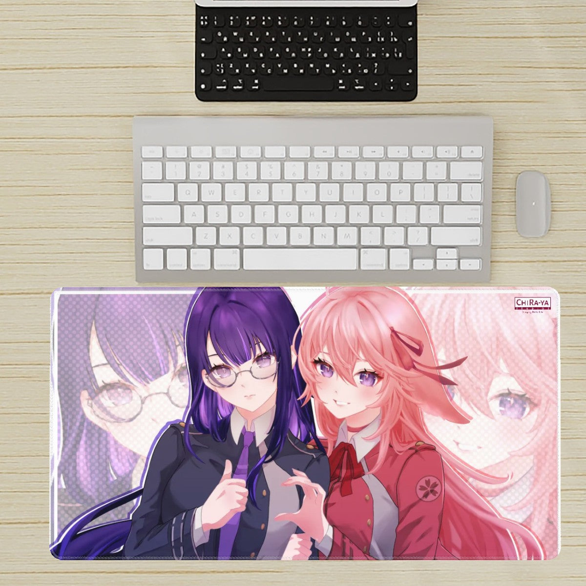 desk setup with extra large anime mouse pad featuring Raiden Ei and Yae Miko dressed as Takina and Chisato